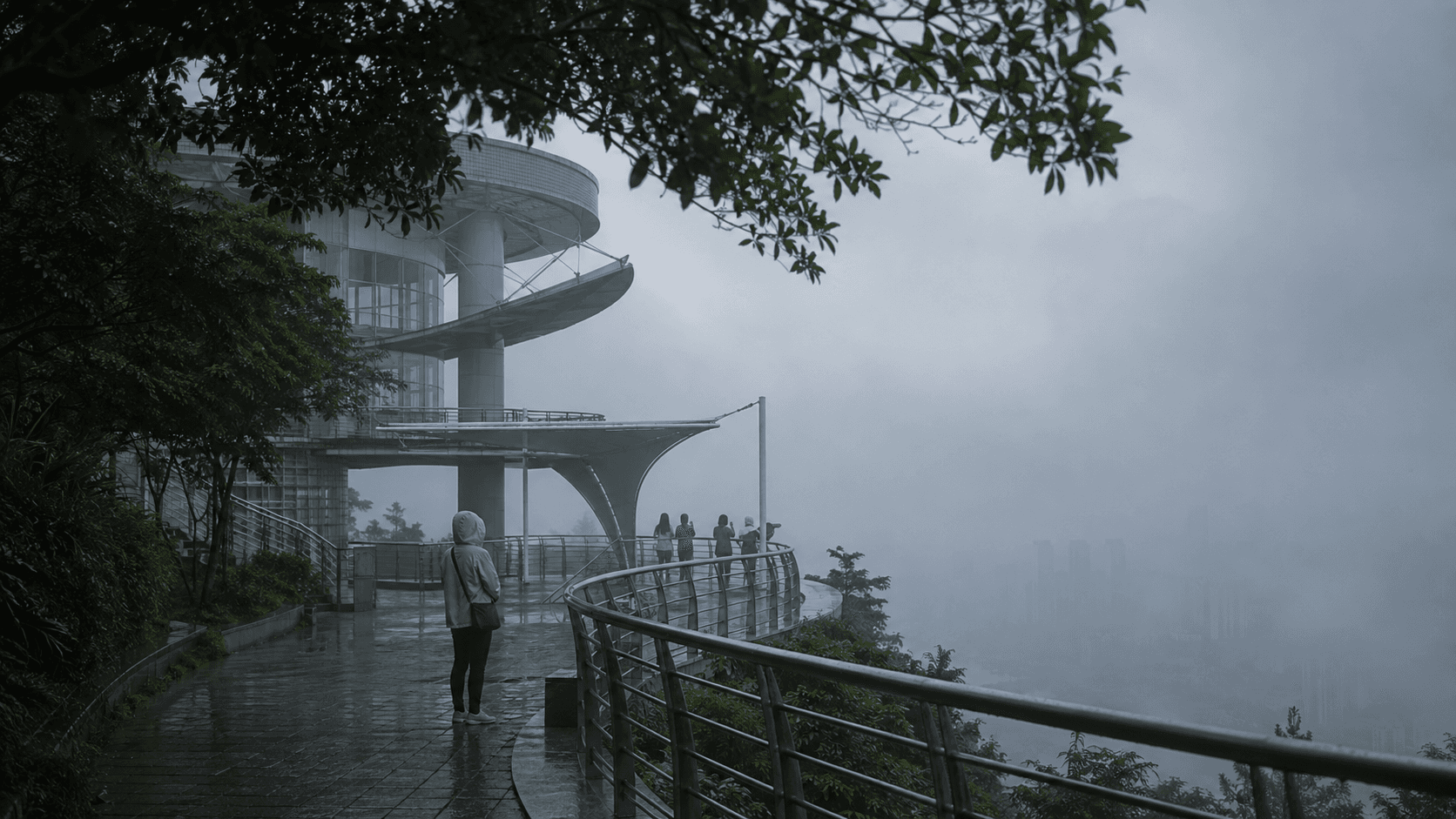 Fog and wet paving at Nanshan One Tree showing limited skyline visibility
